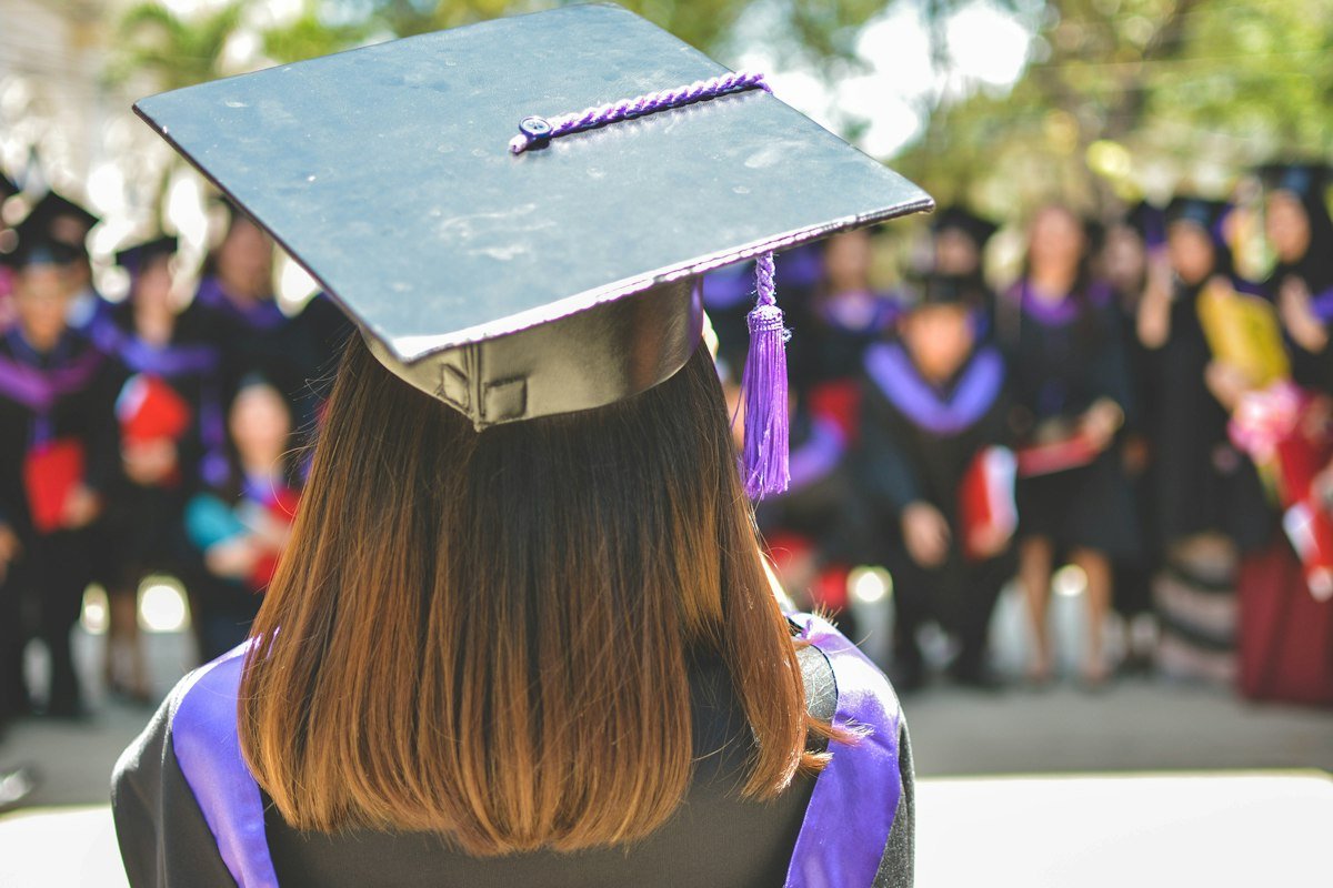 Graduate in cap and gown – education loan for study abroad